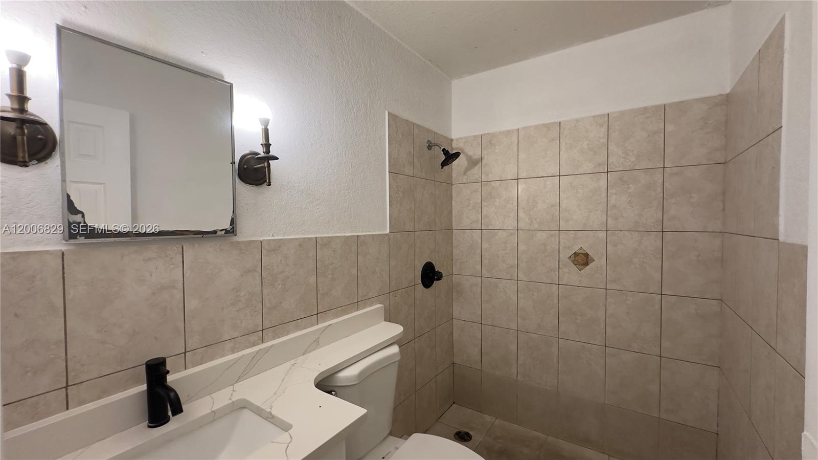 3733 Kirk Road Lake Worth, FL 33461 - Photo 12 of 24 a bathroom with a sink and a shower