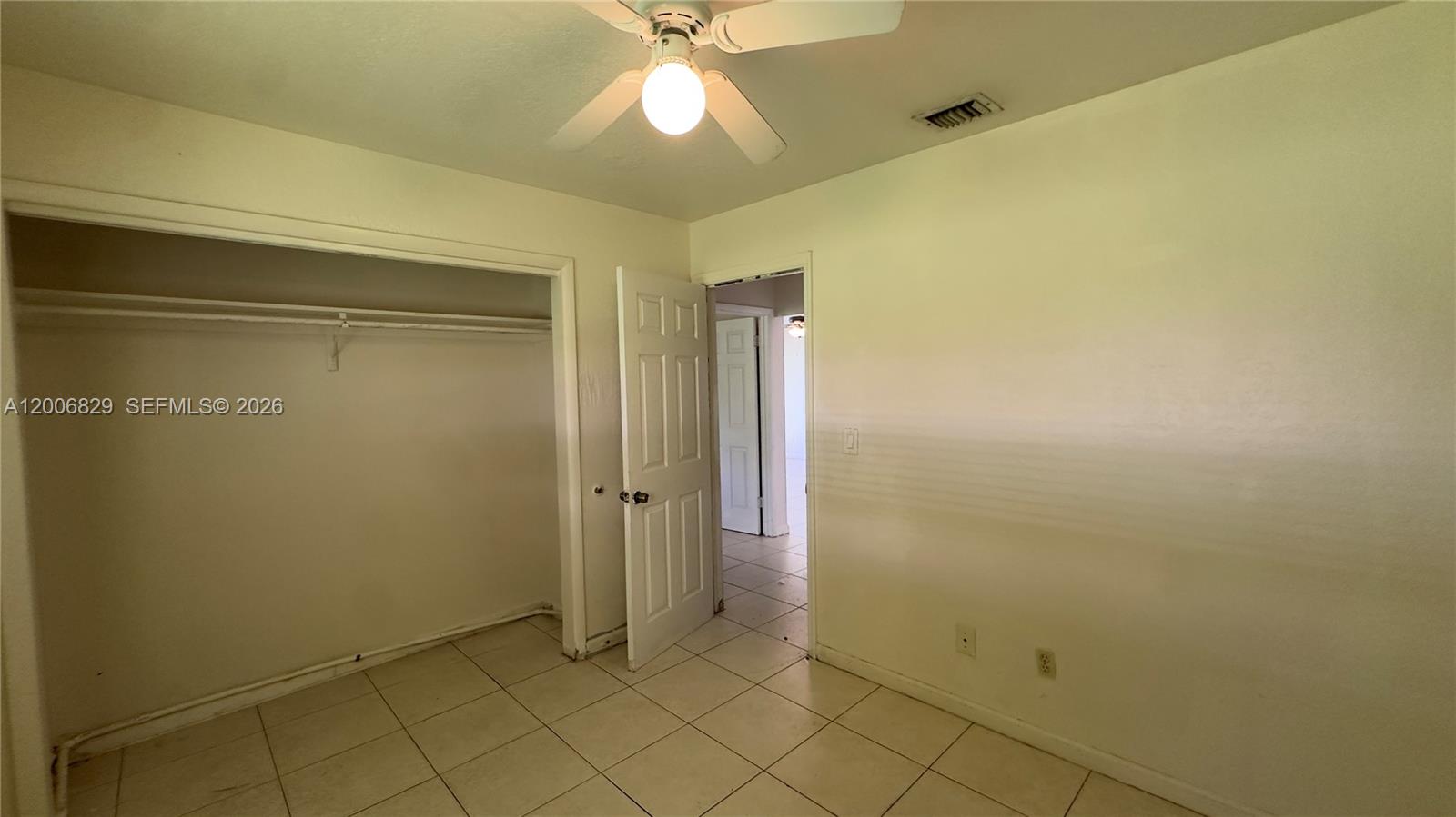 3733 Kirk Road Lake Worth, FL 33461 - Photo 13 of 24 an empty room with a empty space and a ceiling fan