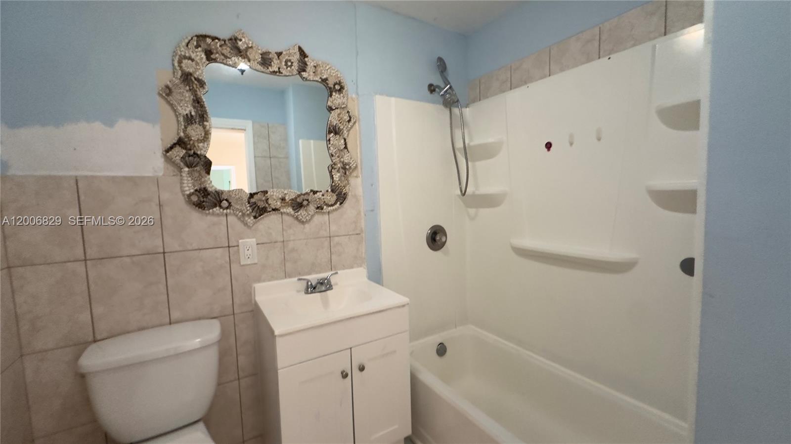 3733 Kirk Road Lake Worth, FL 33461 - Photo 16 of 24 a bathroom with a sink a toilet and shower