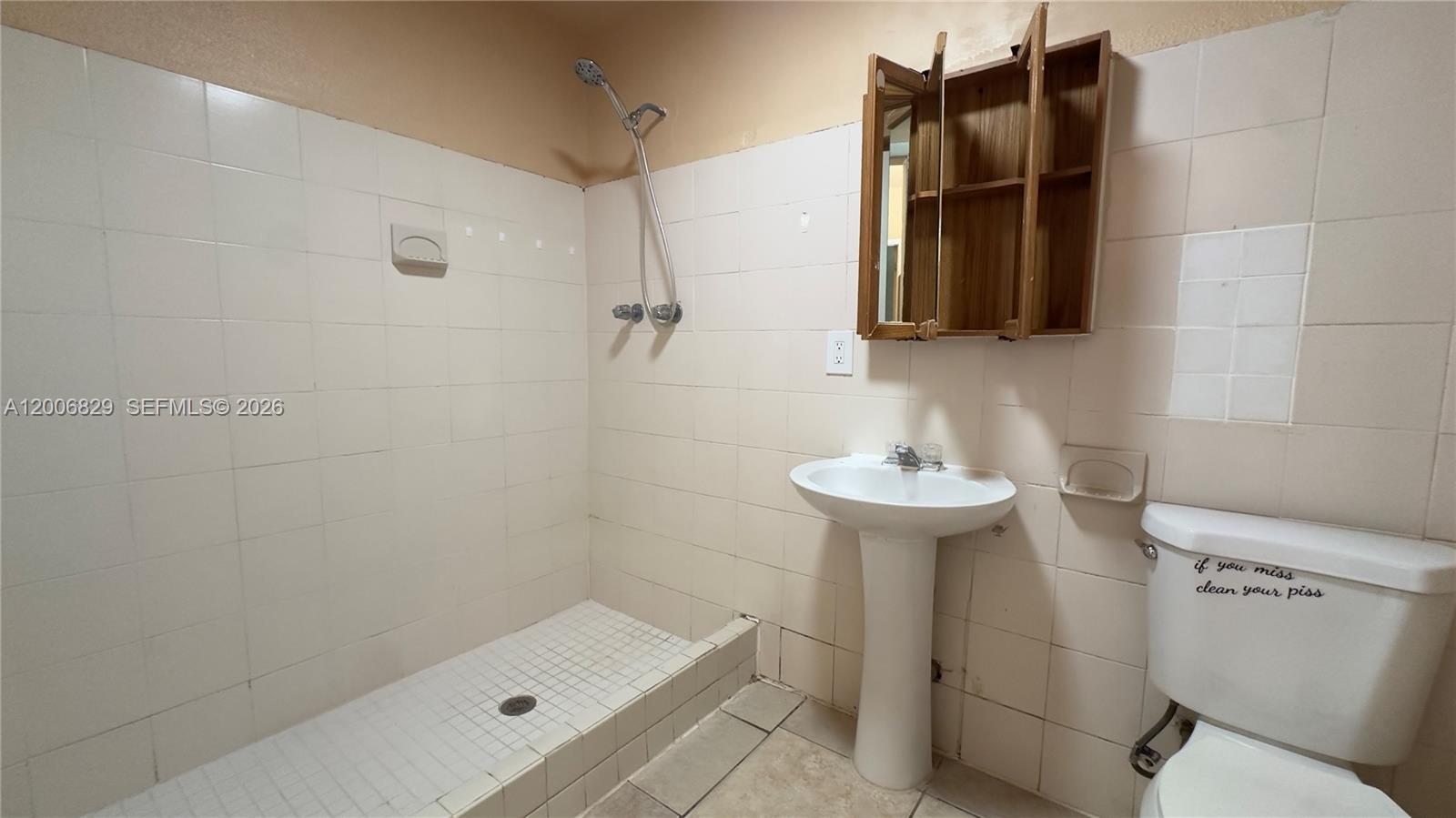 3733 Kirk Road Lake Worth, FL 33461 - Photo 17 of 24 a bathroom with a sink toilet and shower