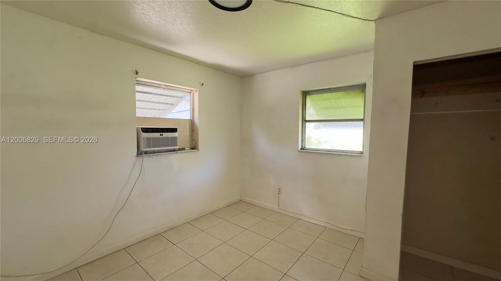 3733 Kirk Road Lake Worth, FL 33461 - Photo 20 of 24 a view of storage and utility room with a window