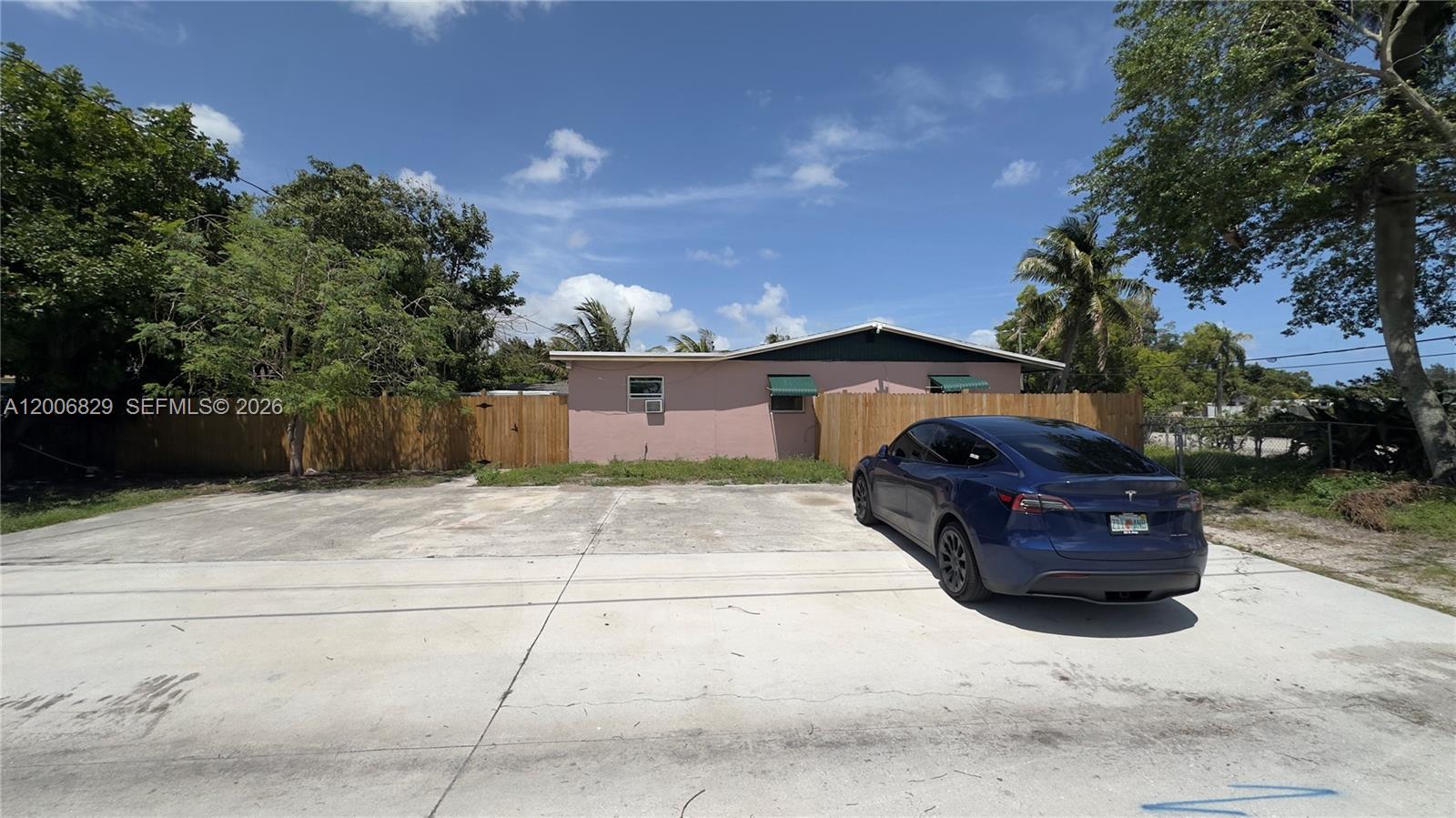 3733 Kirk Road Lake Worth, FL 33461 - Photo 2 of 24 a front view of a house with a yard