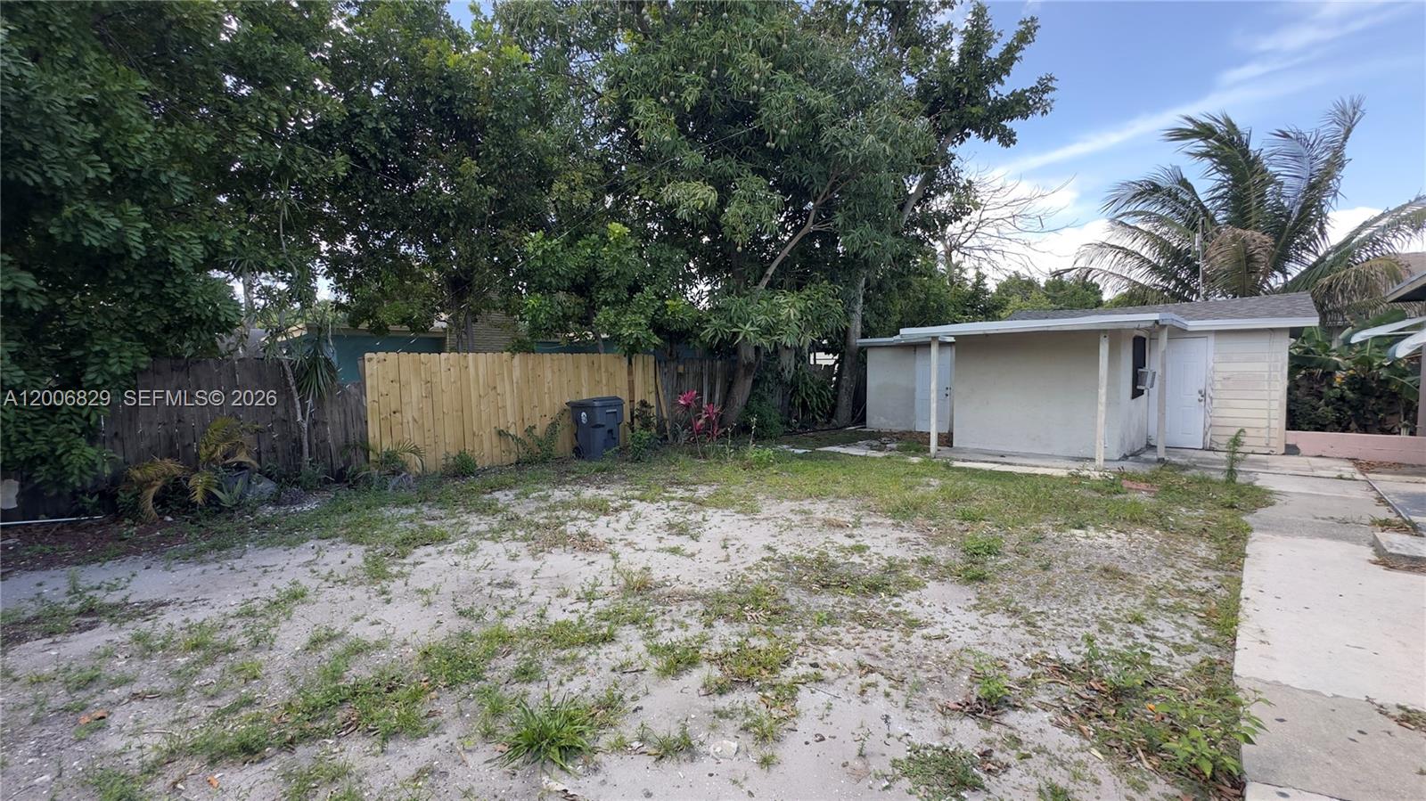 3733 Kirk Road Lake Worth, FL 33461 - Photo 21 of 24 a backyard of a house with plants and tree