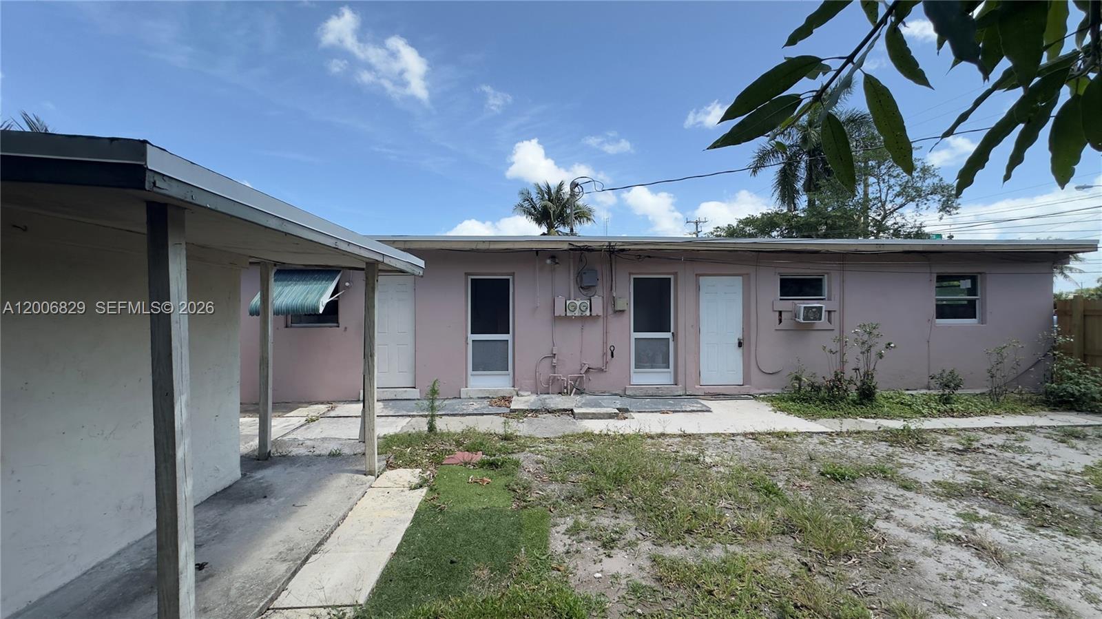 3733 Kirk Road Lake Worth, FL 33461 - Photo 22 of 24 a front view of a house with garden