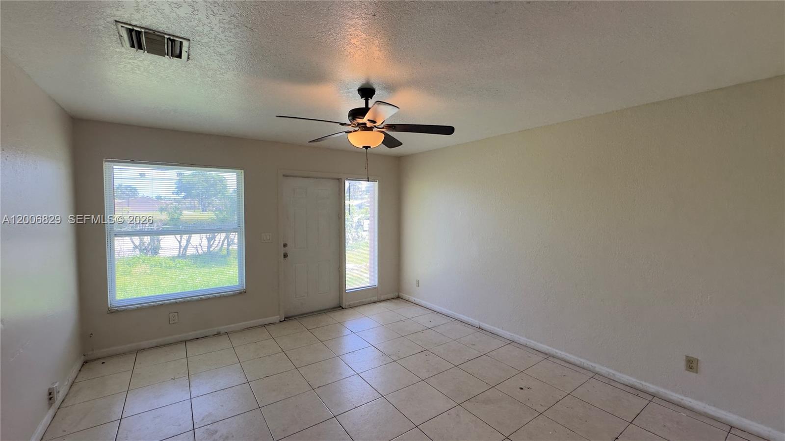 3733 Kirk Road Lake Worth, FL 33461 - Photo 10 of 24 a view of an empty room with a window