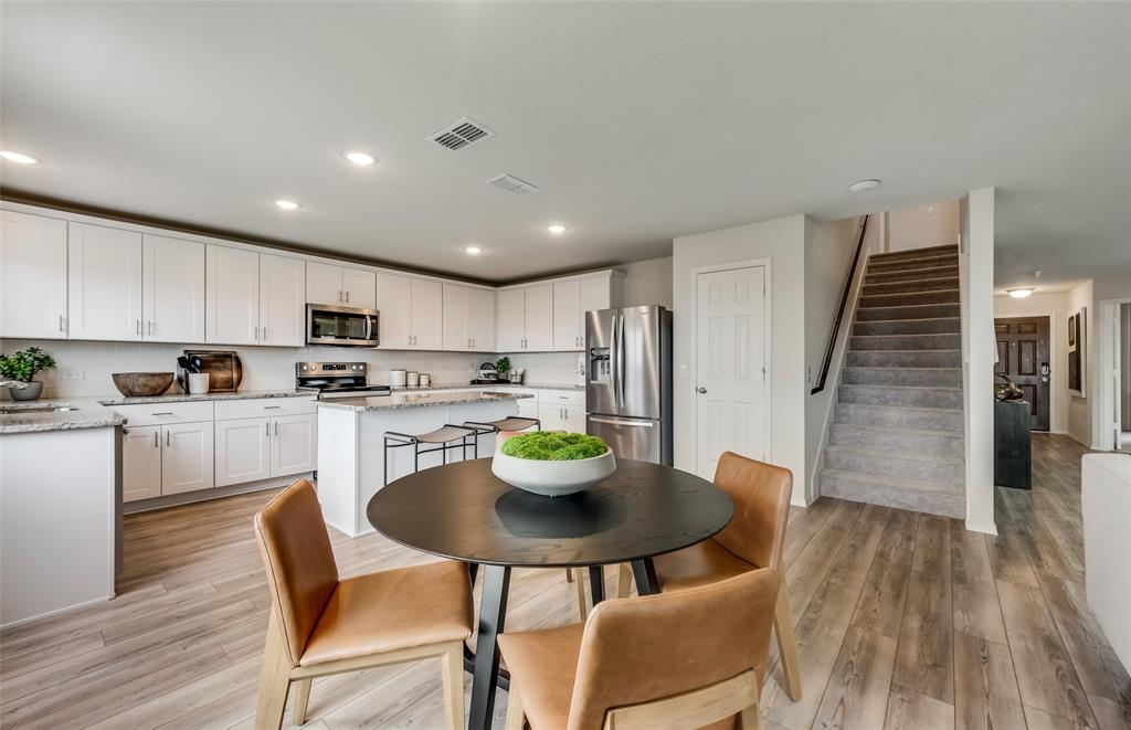 1092 Clear Dusk Lane Forney, TX 75126 - Photo 7 of 17 Dining nook off kitchen with large windows *Model Representation*