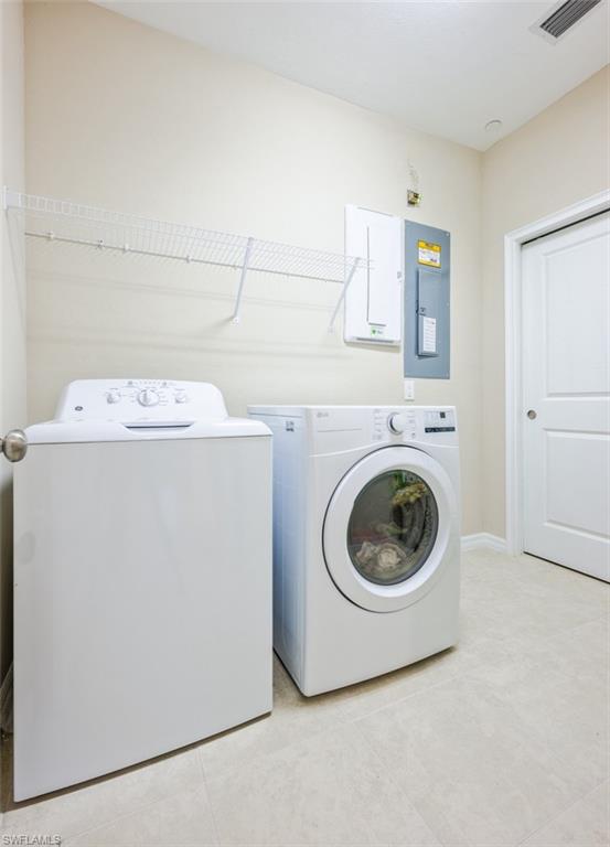 9374 Pocida Court, Unit 102 Naples, FL 34119 - Photo 16 of 21 a utility room with dryer and washer