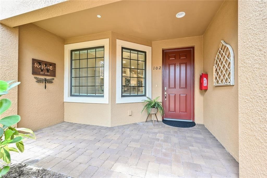 9374 Pocida Court, Unit 102 Naples, FL 34119 - Photo 17 of 21 a view of entryway front of a house