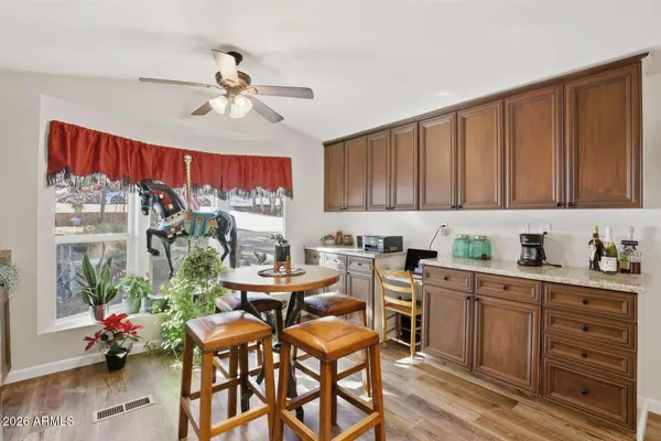 a view of a dining room with furniture window and wooden floor