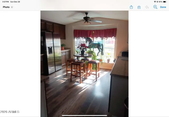 a dining room with furniture and wooden floor