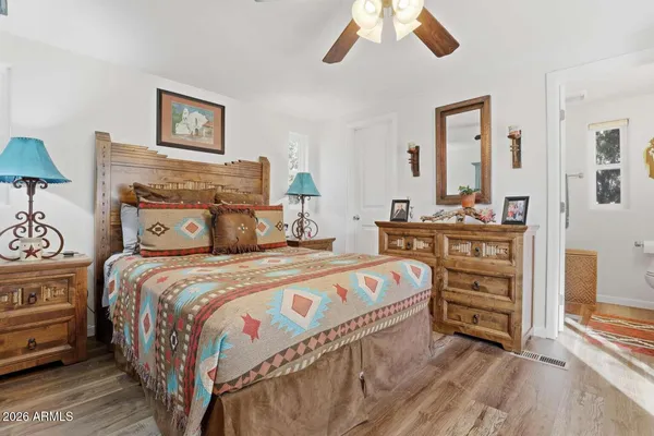 a bedroom with a bed and a cabinets