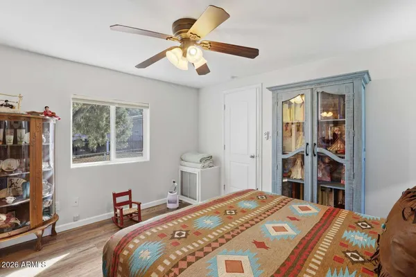 a bedroom with a bed furniture and a window