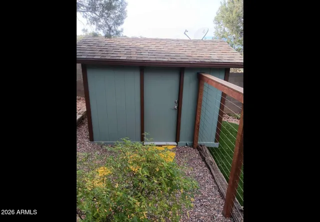 a view of a backyard of the house