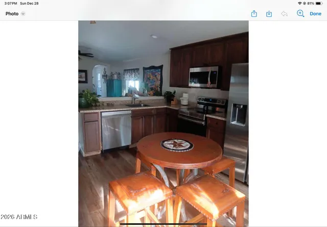 a kitchen with a stove a microwave and cabinets