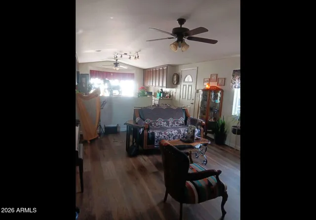 a view of living room with furniture and a chandelier