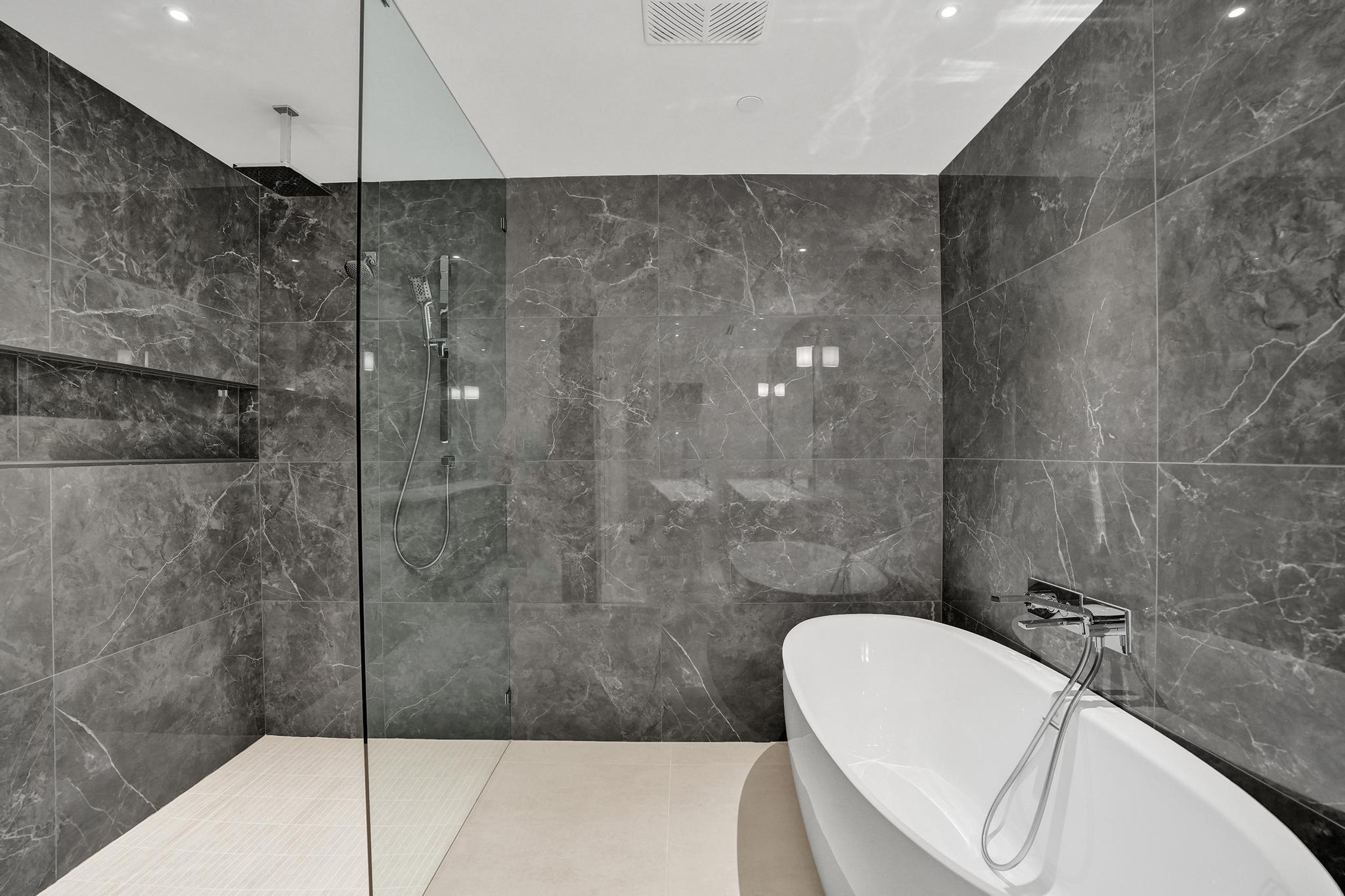 407 North Riverside Drive, Unit 602 Pompano Beach, FL 33062 - Photo 27 of 83 a bathroom with a bathtub and shower