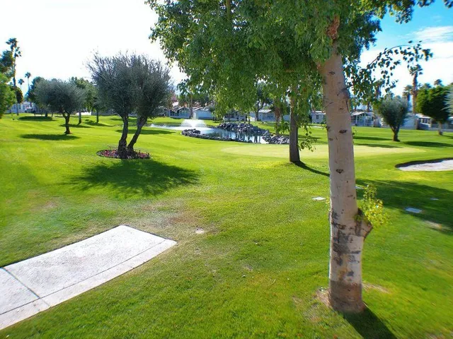 a view of a park with swings and slides