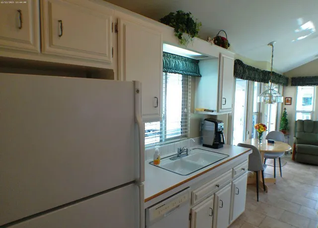 a bathroom with a sink a toilet and a shower