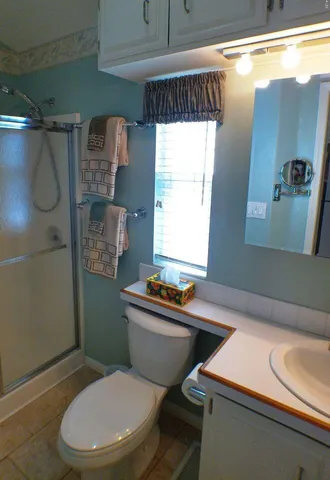 a dining room with furniture and a window
