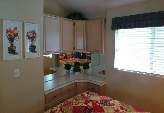 a bedroom with bed and window