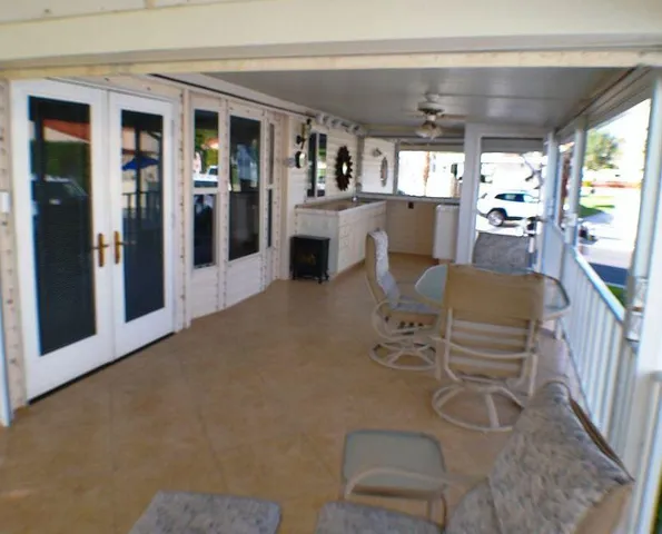 a view of a patio with a table and chairs