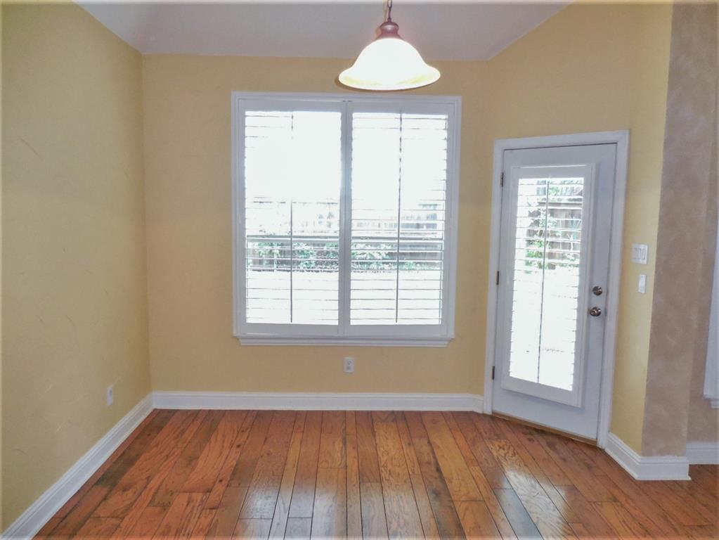 4012 Appleton Lane Flower Mound, TX 75022 - Photo 13 of 28 an empty room with wooden floor and windows