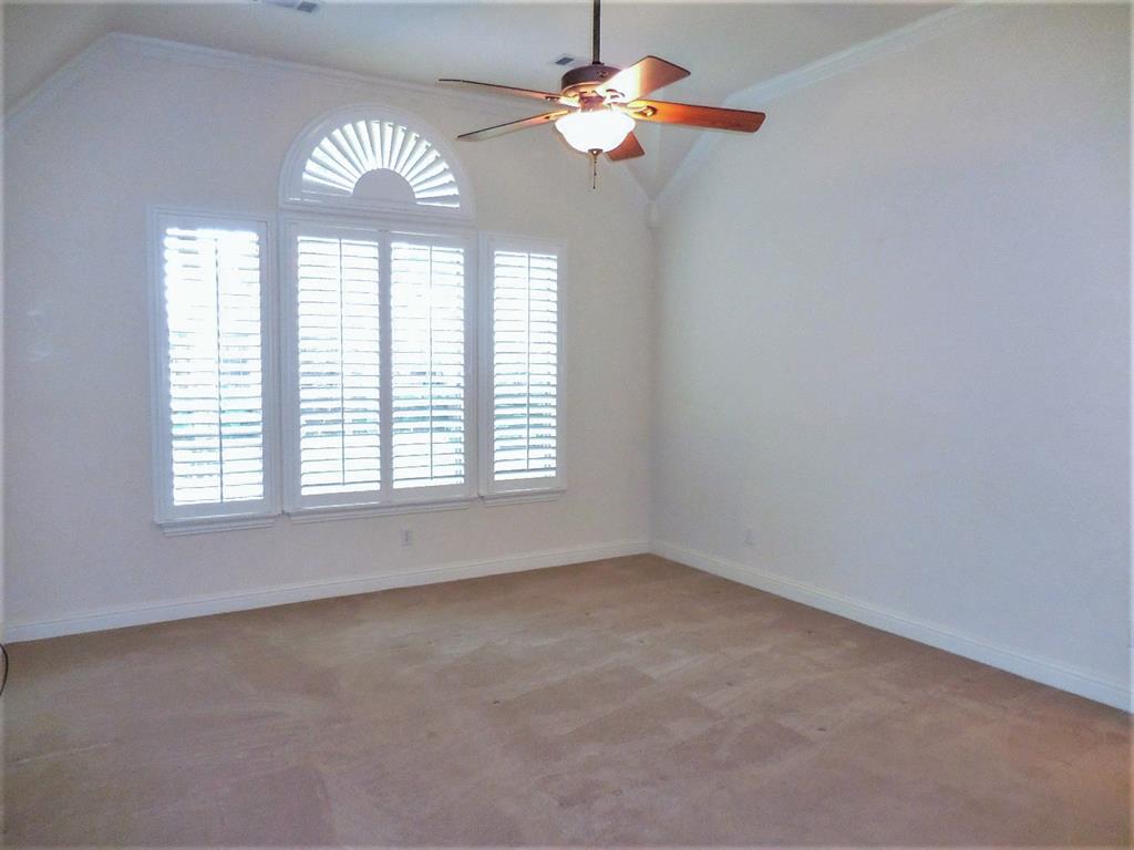 4012 Appleton Lane Flower Mound, TX 75022 - Photo 15 of 28 an empty room with windows and fan