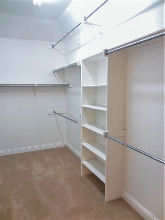 4012 Appleton Lane Flower Mound, TX 75022 - Photo 18 of 28 a view of an empty walk in closet