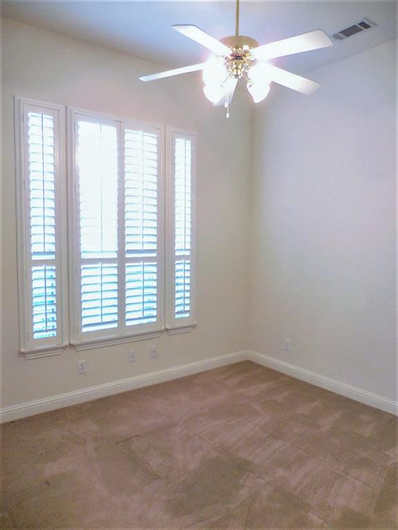 4012 Appleton Lane Flower Mound, TX 75022 - Photo 21 of 28 an empty room with windows and ceiling fan