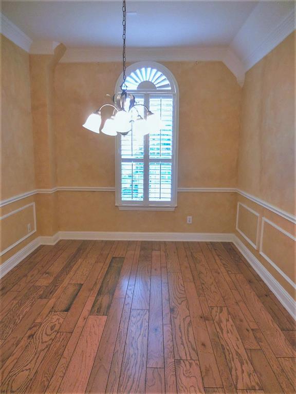 4012 Appleton Lane Flower Mound, TX 75022 - Photo 4 of 28 a view of an empty room with wooden floor and a window