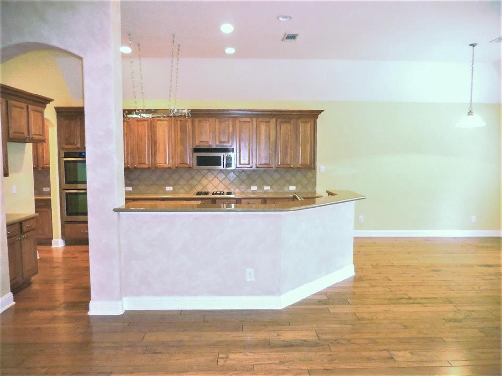 4012 Appleton Lane Flower Mound, TX 75022 - Photo 7 of 28 a view of kitchen with stainless steel appliances granite countertop sink
