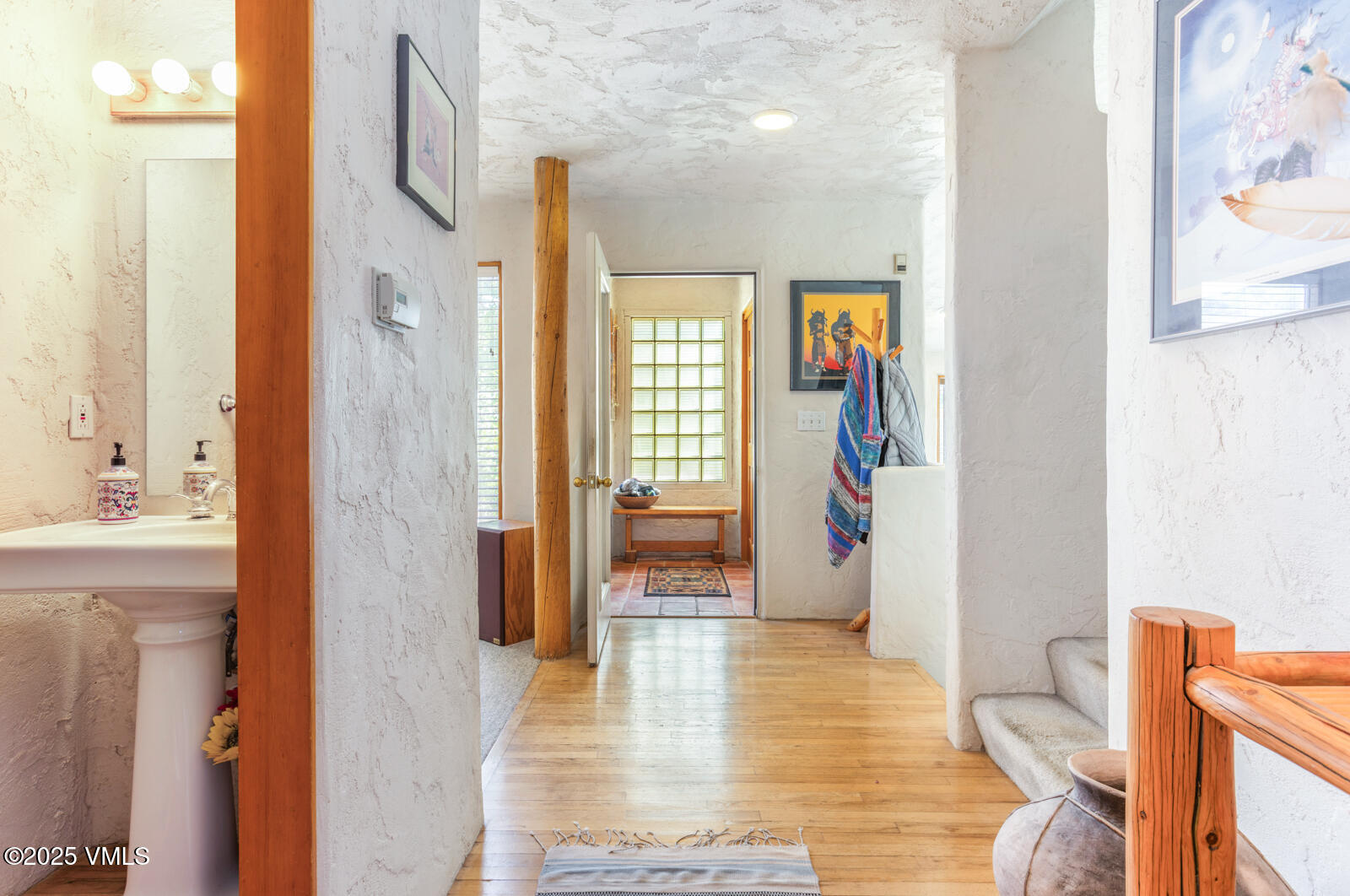 20 Hereford Road Edwards, CO 81632 - Photo 10 of 32 a view of a hallway with wooden floor and furniture