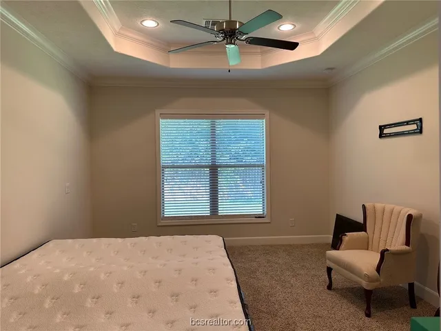 a bedroom with furniture and a window