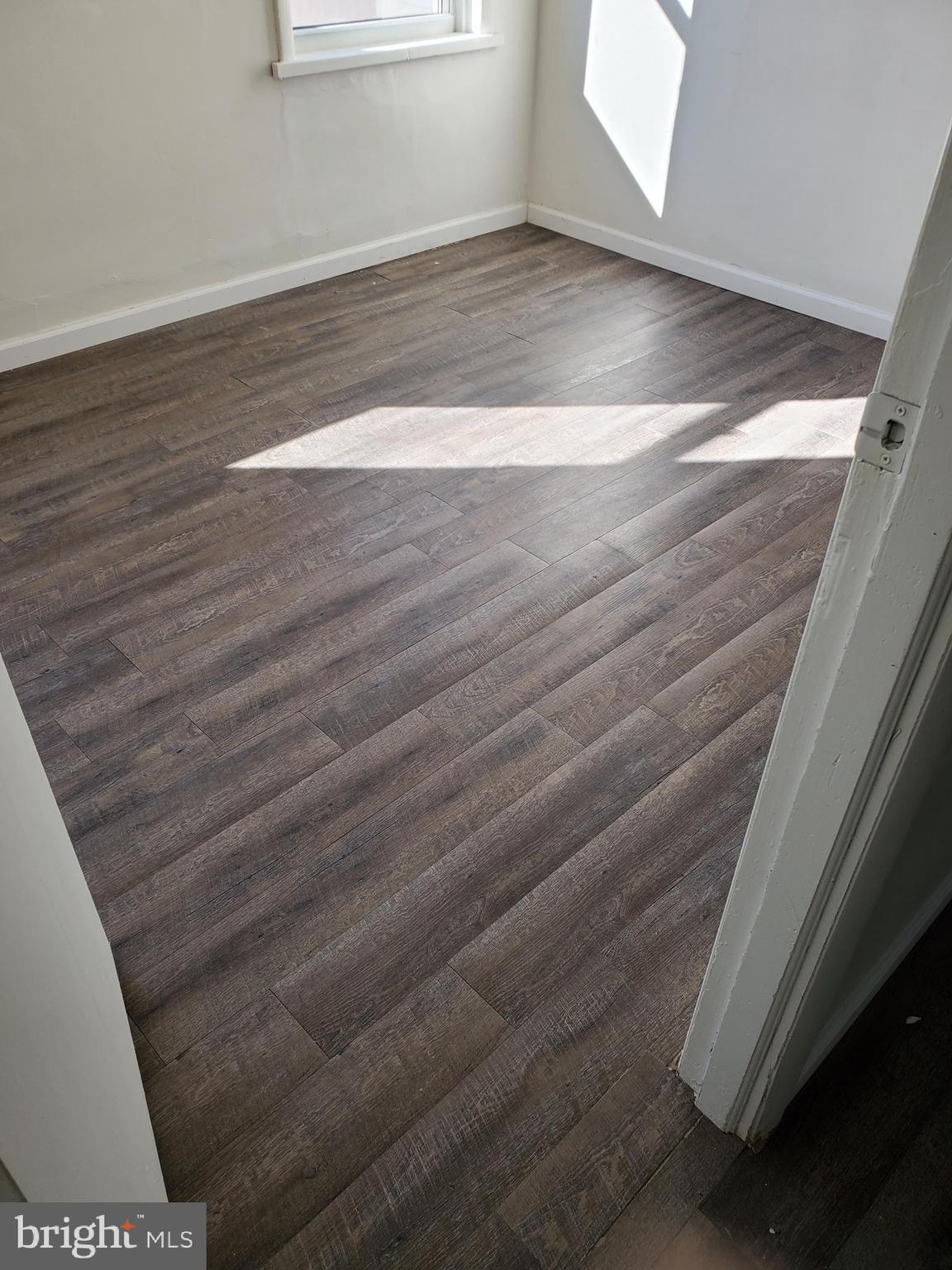 6713 Marsden Street Philadelphia, PA 19135 - Photo 3 of 13 a view of a room with wooden floor