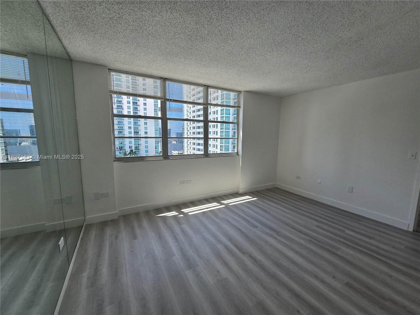 999 Brickell Bay Drive, Unit 1908 Miami, FL 33131 - Photo 11 of 38 Master Bedroom