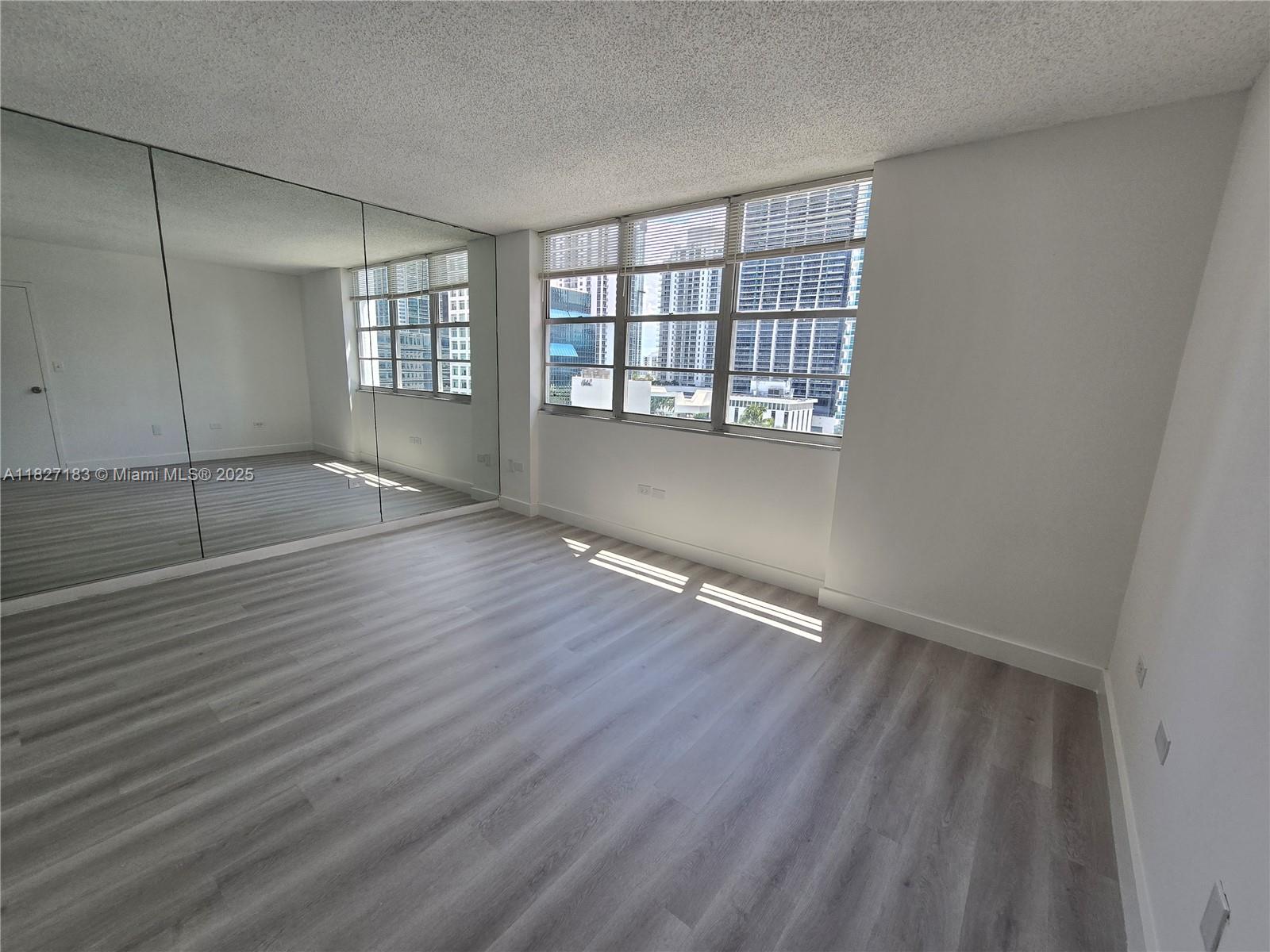 999 Brickell Bay Drive, Unit 1908 Miami, FL 33131 - Photo 10 of 38 Master Bedroom