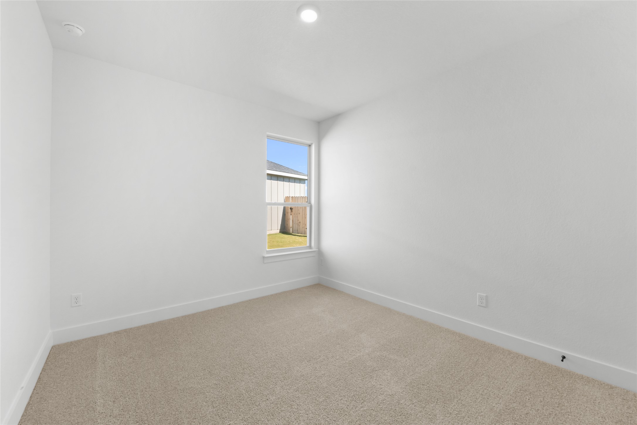 560 Gus Loop Georgetown, TX 78626 - Photo 12 of 17 a view of an empty room and a window