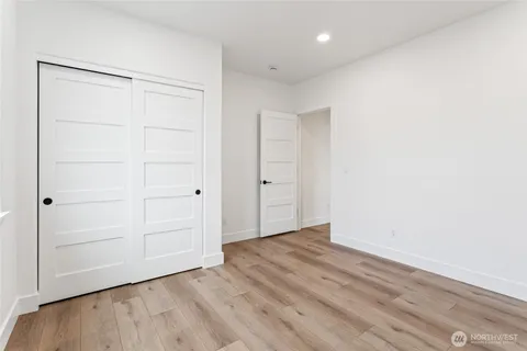 an empty room with wooden floor