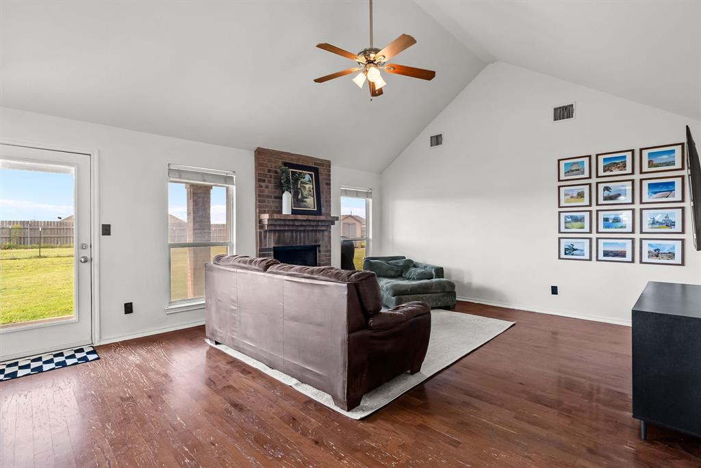 115 Blue Castle Court Weatherford, TX 76088 - Photo 17 of 33 a living room with furniture and a flat screen tv