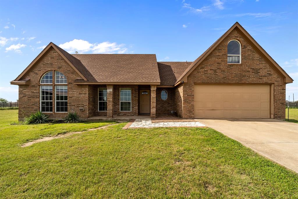 115 Blue Castle Court Weatherford, TX 76088 - Photo 2 of 33 a front view of a house with a garden