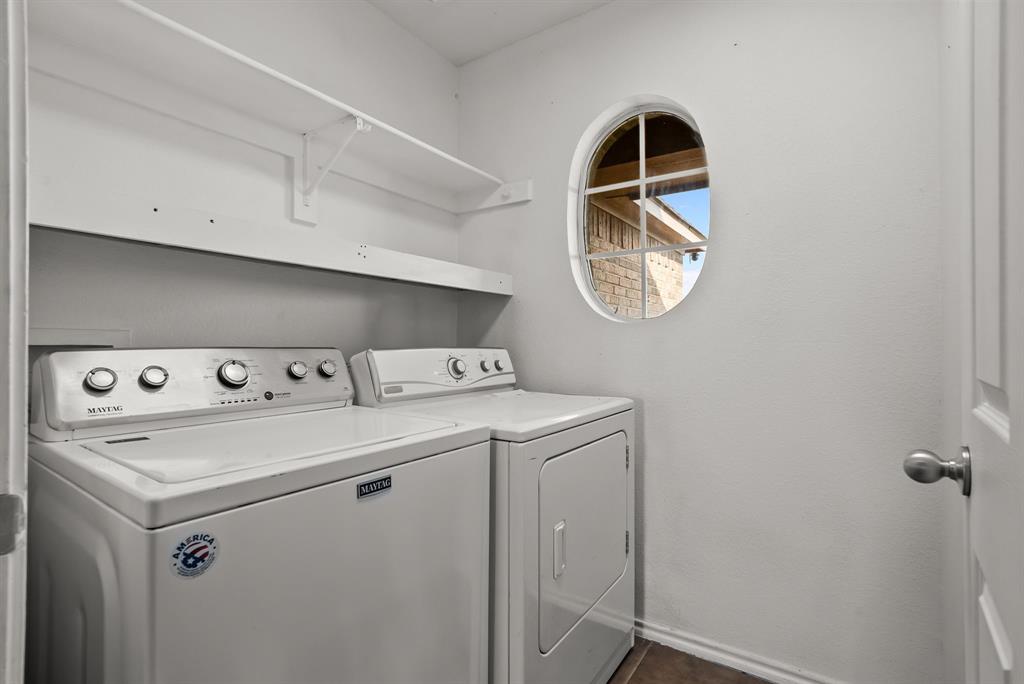 115 Blue Castle Court Weatherford, TX 76088 - Photo 23 of 33 a utility room with dryer and washer