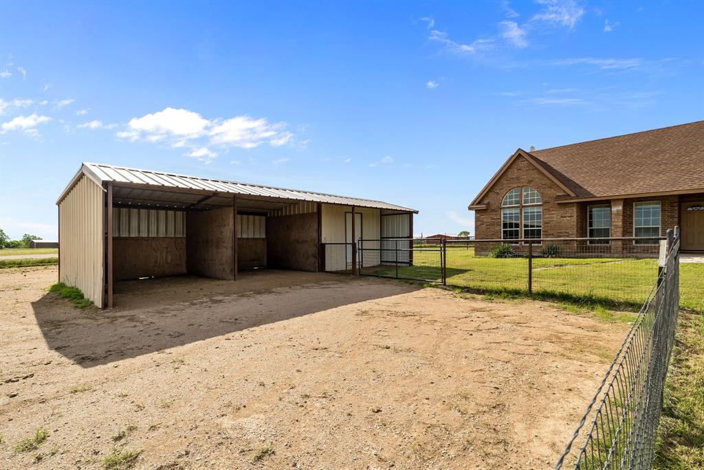 115 Blue Castle Court Weatherford, TX 76088 - Photo 26 of 33 a view of a house with a yard