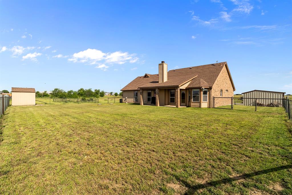 115 Blue Castle Court Weatherford, TX 76088 - Photo 3 of 33 a front view of a house with a yard