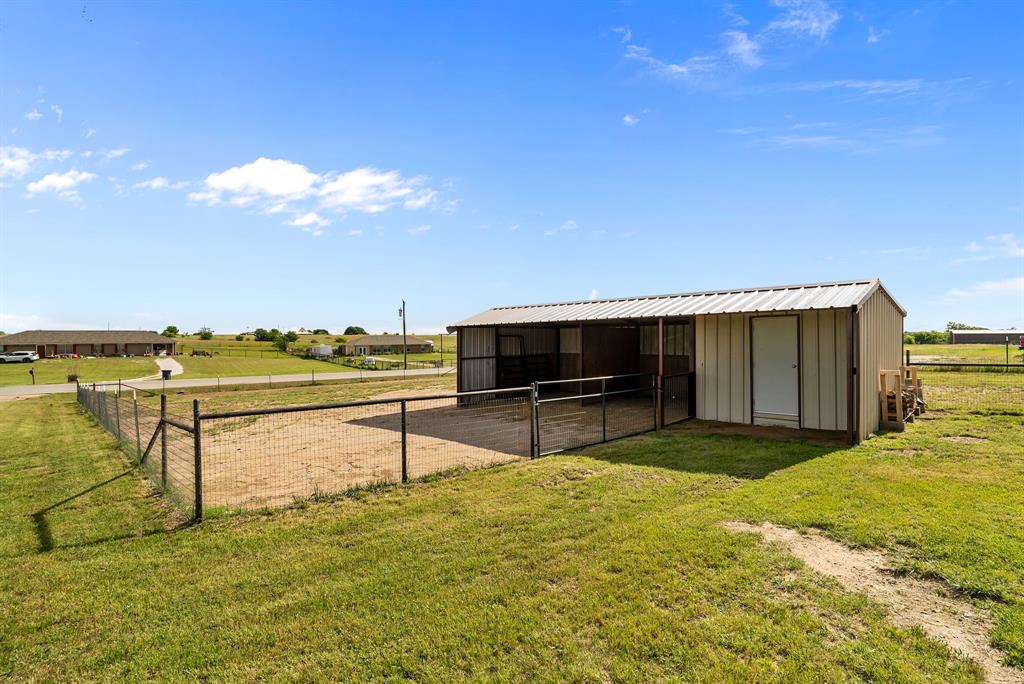 115 Blue Castle Court Weatherford, TX 76088 - Photo 5 of 33 a view of a terrace with chairs