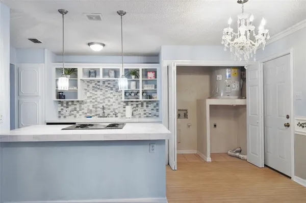 a view of a kitchen with a sink and dishwasher