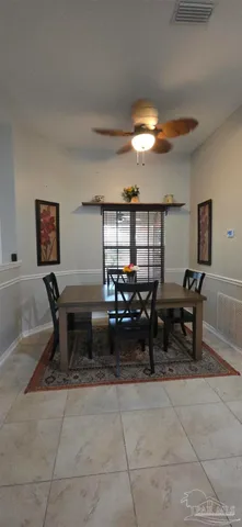 a living room with furniture a rug and a table