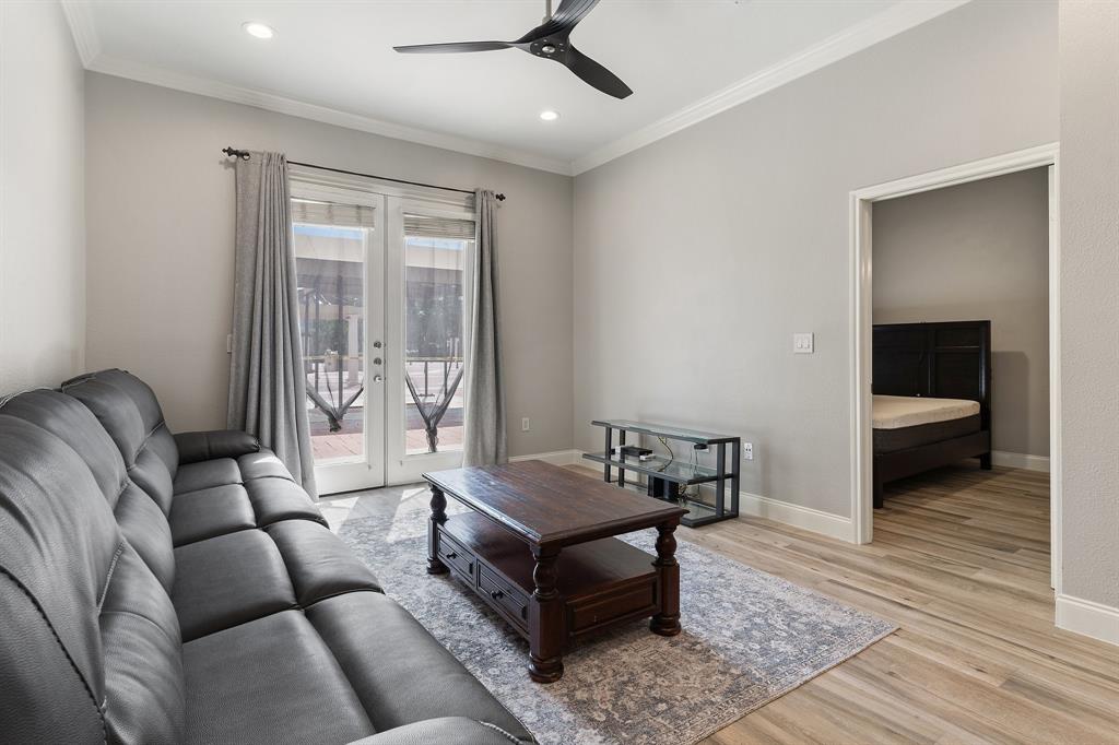 3102 Kings Road, Unit 1106 Dallas, TX 75219 - Photo 8 of 20 a living room with furniture and a ceiling fan