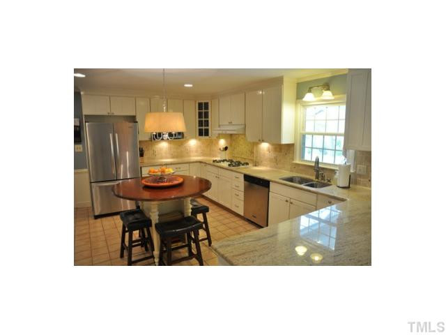 8904 Hunting Trail Raleigh, NC 27613 - Photo 2 of 20 Beautiful, completely upgraded, eat-in kitchen features granite counter tops, tile backsplash, stainless steel appliances and more! Kitchen
