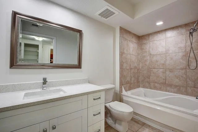 a bathroom with a toilet sink and bathtub