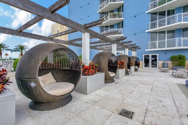 a view of a swimming pool with a lounge chairs